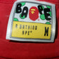 A Bathing Ape “Nikki Beach” Ape Head Graphic T-Shirt Red Size M