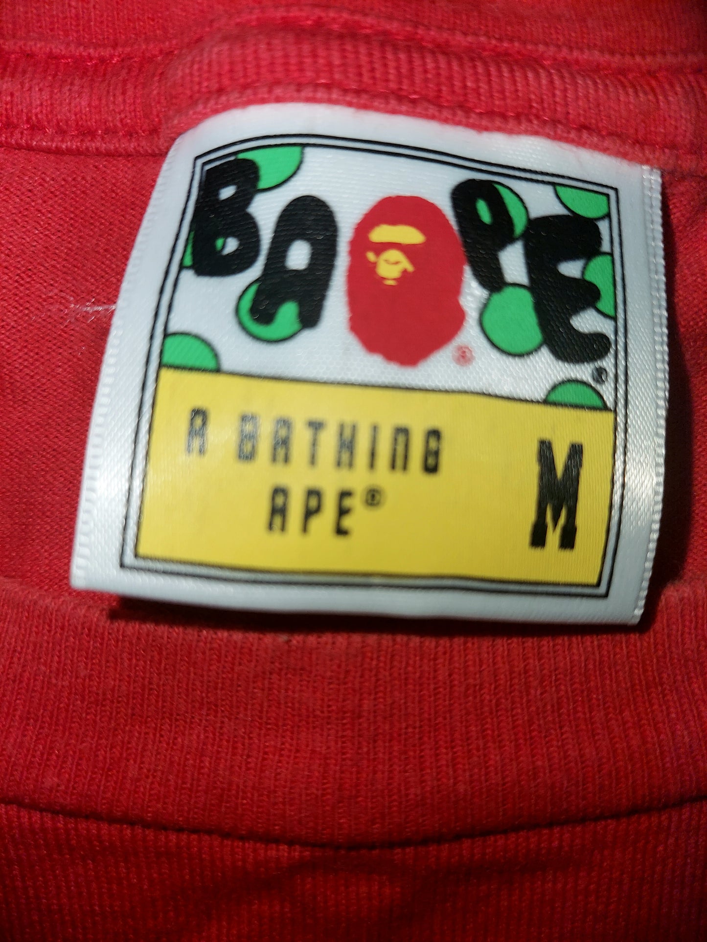 A Bathing Ape “Nikki Beach” Ape Head Graphic T-Shirt Red Size M